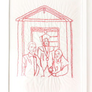 Ibu Munah's final framed embroidery of her family. It features three figures standing in front of a building with a peaked roof. The girl in the middle has a graduation cap on and is smiling.