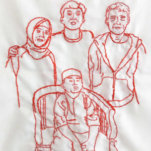 Ibu Mariah's final embroidery of her family. There are four figures, a man and a woman and two boys, one standing between the parents and the younger boy sitting on a chair in front of everyone.
