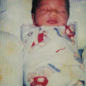 A picture of a baby swaddled in a blanket